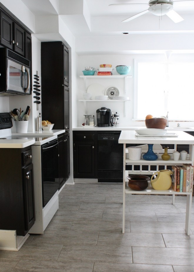 Kitchen transformation progress as of February 2013. Cabinets have been gel stained dark brown, countertops updated with acrylic white.