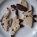Finished dipped and splattered dinosaurs.