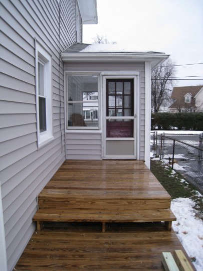 Here's the area the new pergola was being installed. That's the sunroom (note how close the door is to the edge of the deck).