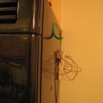Green Sugru hook for pot holders.