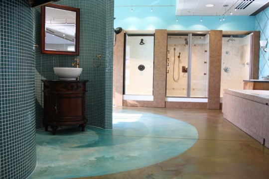Delta Headquarters Lobby Showroom. Loving the painted concrete floors and tile as much as the fixtures.