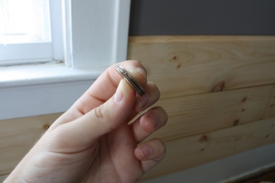 Glued together quarters serve as spacers in the paneling.