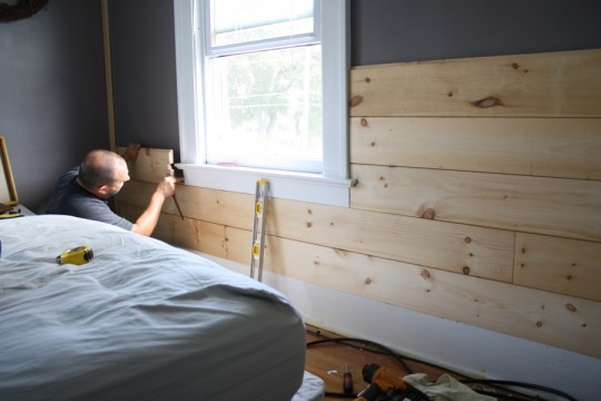 Fitting boards around the window sill, working up from the bottom. 