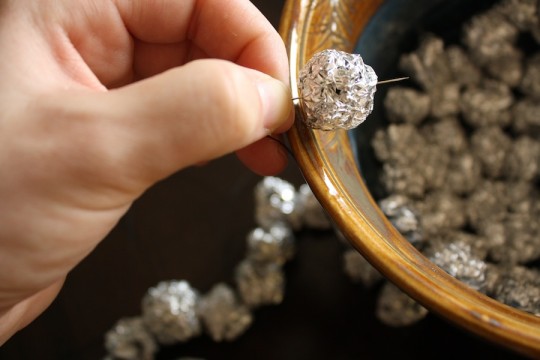 Tree garland with foil and string.