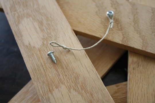 Used some tiny screws from my scrap drawer to loop a string on the back of the star.