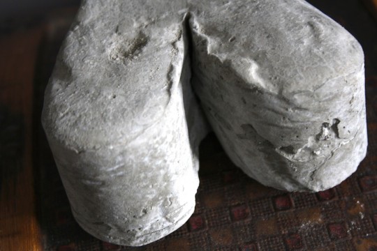 Finished portland cement doorstop.