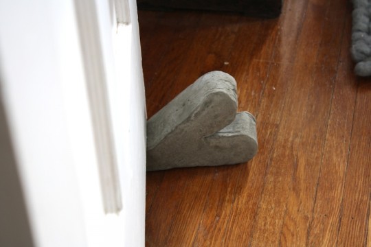 Finished portland cement doorstop.