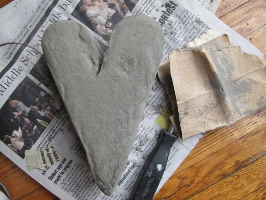 Lightly sanding the curing cement smoothed out rough edges and lumps.