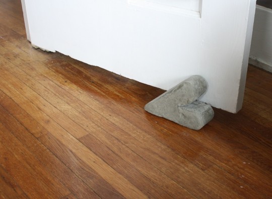 Finished portland cement doorstop.