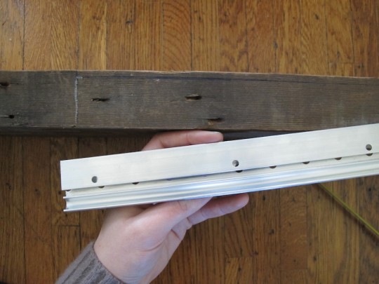 Marking where the french cleat would be attached to the edge of the shelf. Marking where the french cleat would be attached to the edge of the shelf.