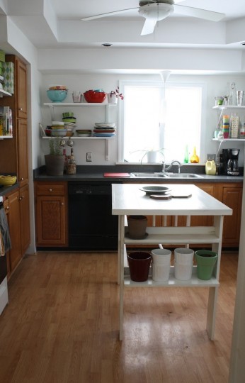 Kitchen, with fewer cabinets and open shelves.