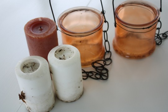 Cheap trio of candles and two hanging jars.