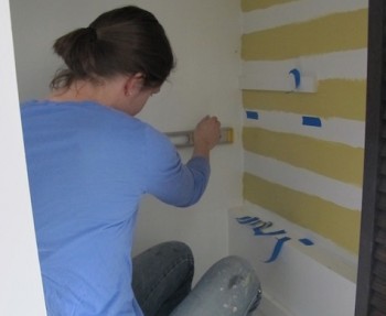 Painting a stairwell closet.
