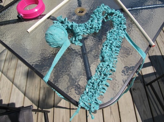 Oh geez, that rug is already way too long. Off the needles you will go.