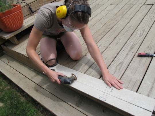 Cutting through the Hardibacker board with a multi tool.