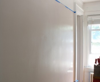 Painting Julia's bedroom with a pink stripe.