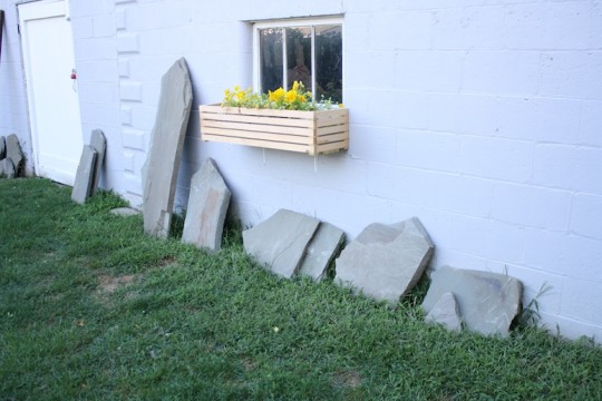 Leftover flagstone pieces alongside the garage.