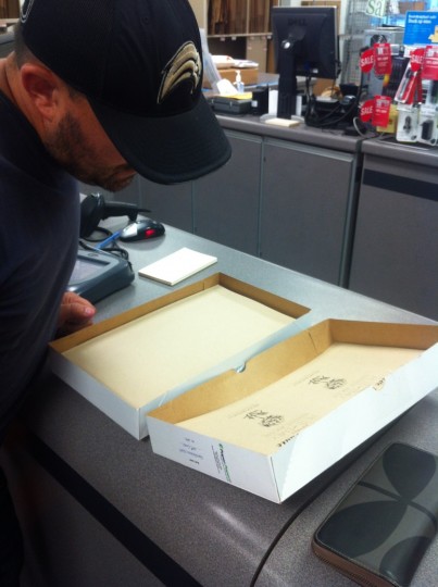 Pete, carefully proofing the first print of the save the date cards at Kinko's.