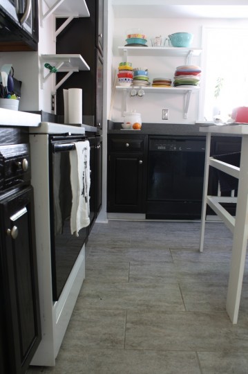 Kitchen cabinets, refinished with dark brown stain.