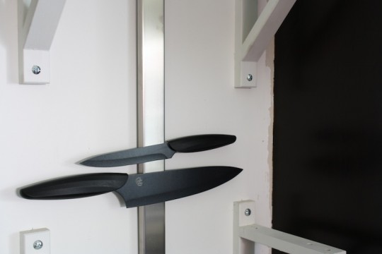 Testing out the new black knives on our kitchen wall. See how we have some wall touch-ups to do?