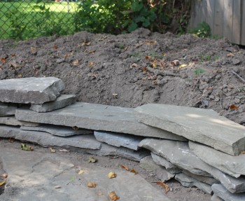 Create a garden border with scrap flagstone.
