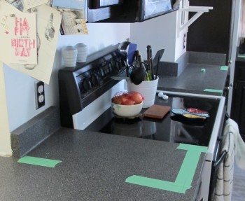 We're shortening this piece of countertop to the left of the stove. The tape marks the new size.