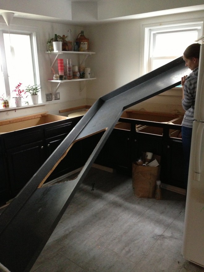 That's a big piece of laminate countertop. And right about here, we almost got it out of the kitchen in one piece.