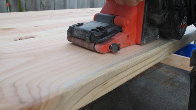 Belt sanding worked great for our rustic tabletop.