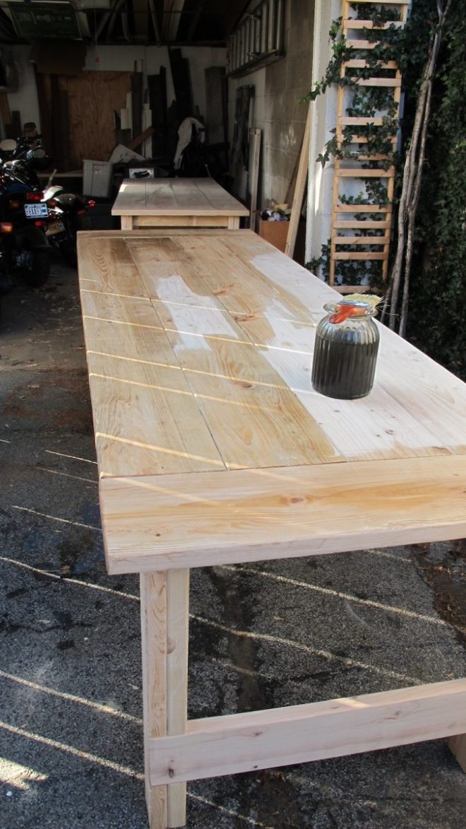 Staining the wedding tables using a natural stain.