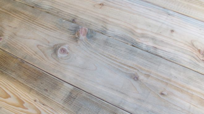 Lumber distressing using natural wood stain.