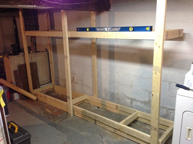 Creating basement shelves out of basic 2x4 boards.