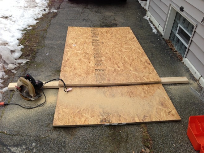 Cutting the shelves to size in the driveway.
