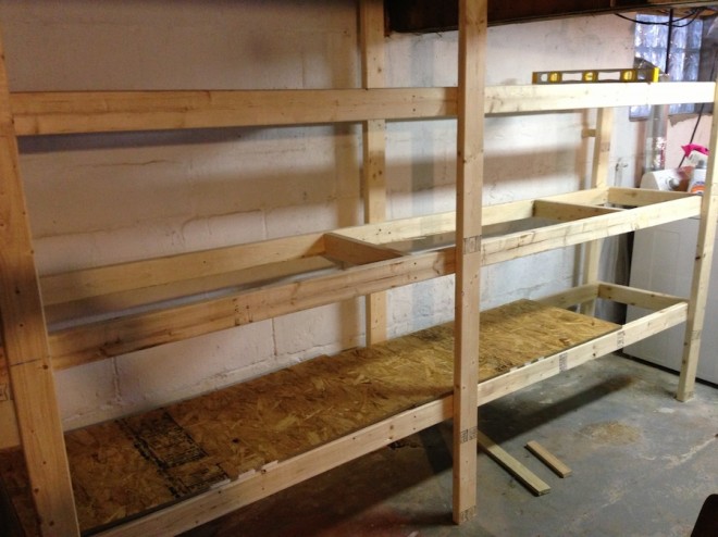 Installing the shelves for our new basement DIY storage.