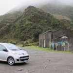 Little Peugeot at the base of a very, very big hill. We found a run down building and no one else.
