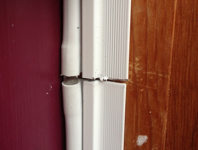Breaks in the clean line of the door weatherizer, an unattractive circumstance.