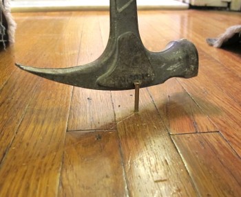 Tapping the end of the screw off, leaving it counter-sunk in the hardwood floors.
