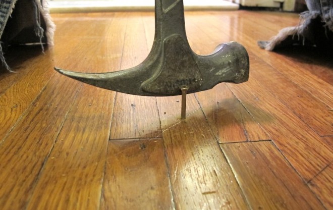 Tapping the end of the screw off, leaving it counter-sunk in the hardwood floors.