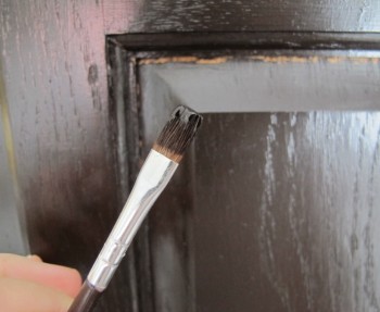 Cracks in the stain on the doors caused by natural expansion and contraction of the oak.