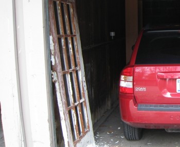 Rehabbing a broken paned door in my apartment garage.